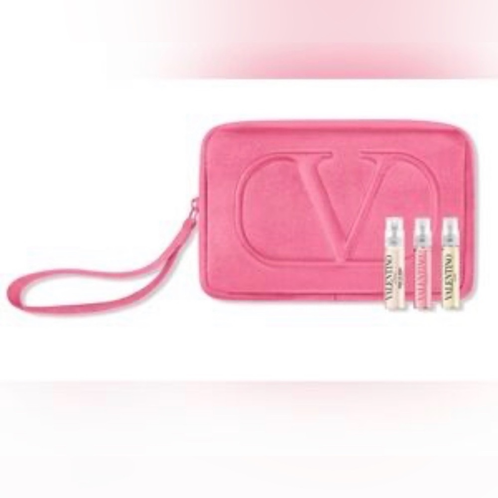 Valentino wristlet with 3 travel perfumes